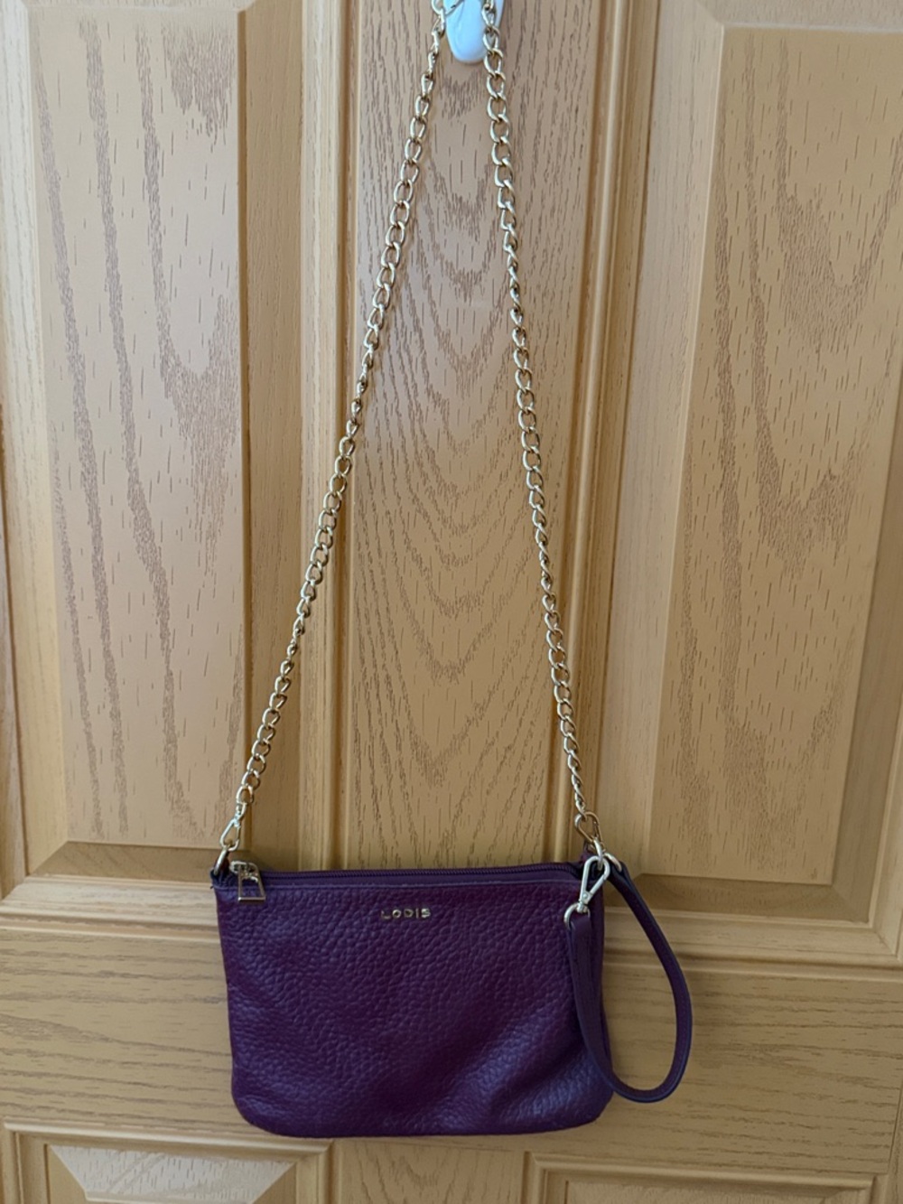 LODIS Burgundy  Leather Crossbody Bag with Gold Chain Strap and wristlet.